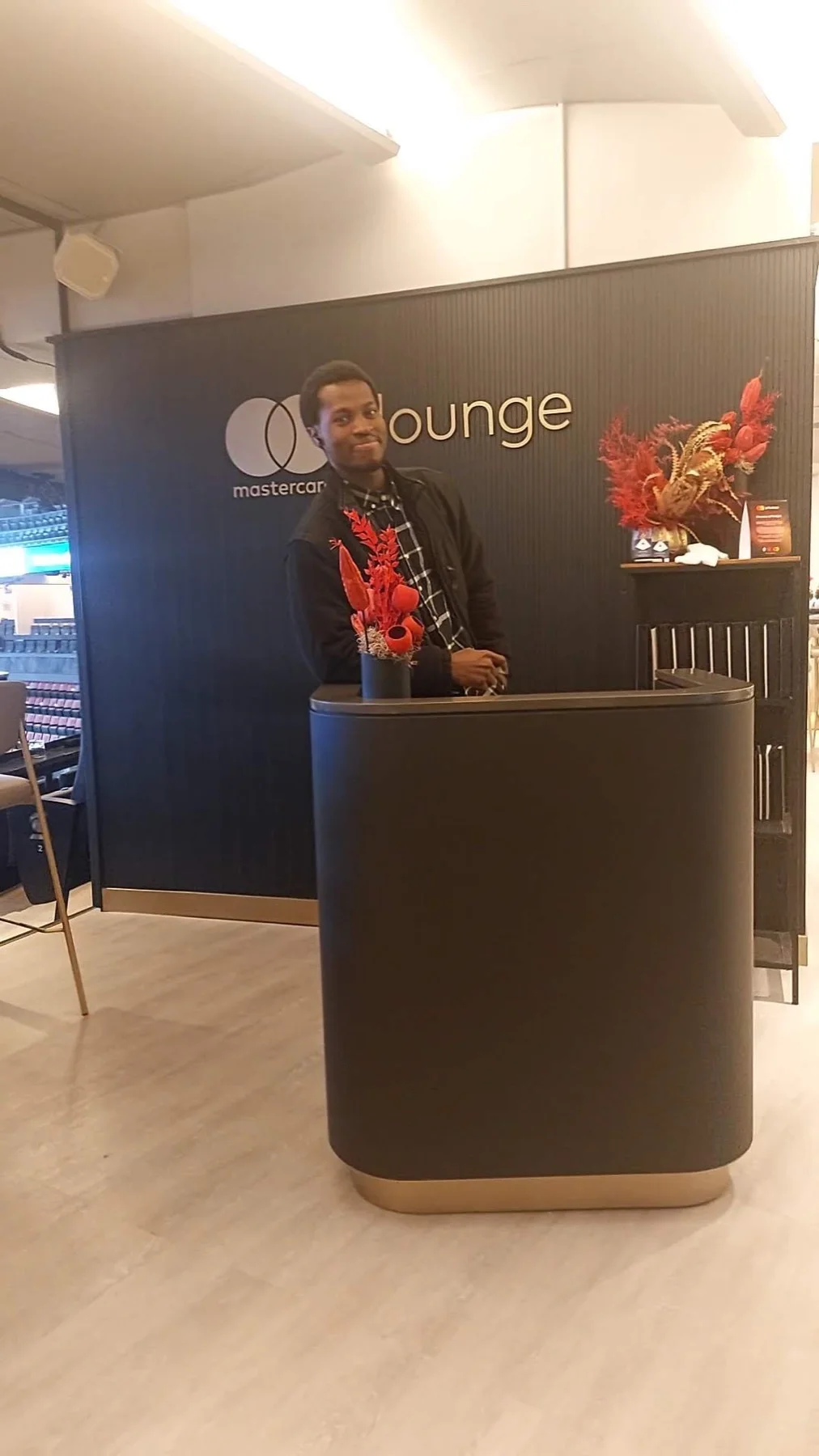 John at the Mastercard Lounge concierge desk during a site visit